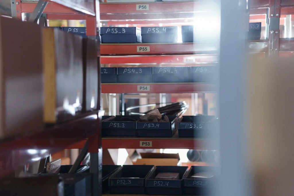 Warehouse shelving with numbered bins for parts storage